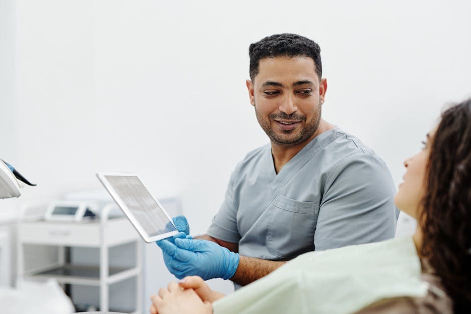 Clinician reviewing patient intake details on a tablet