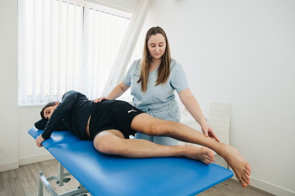 Physiotherapist working with a patient in a treatment room